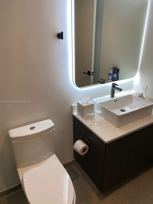227 NE 2nd St Unit 1910, Miami, FL 33132 - bathroom with baseboards, toilet, and vanity