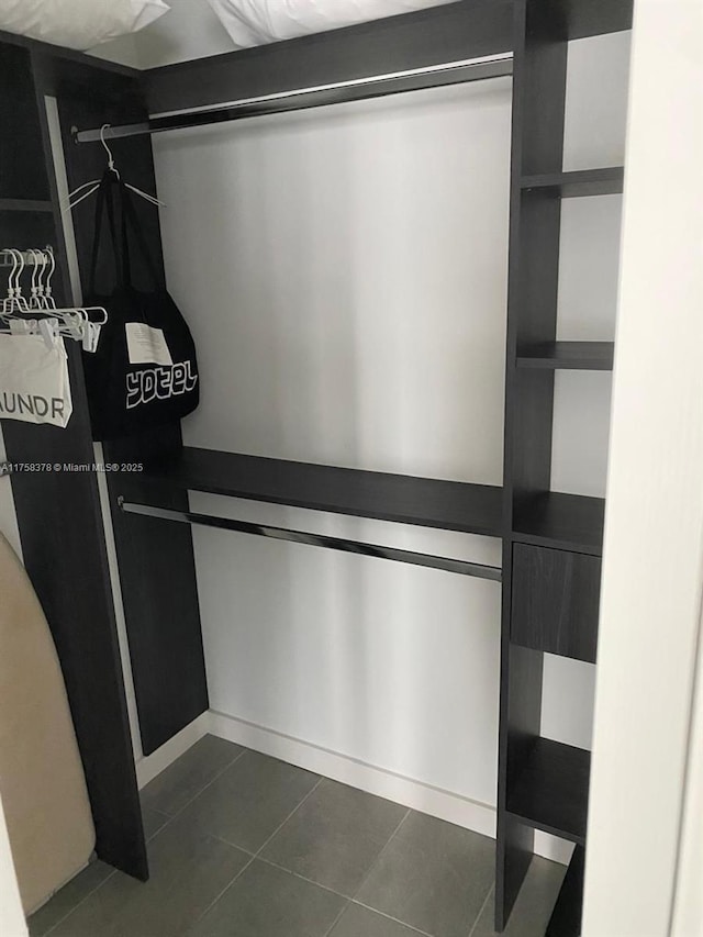 227 NE 2nd St Unit 1910, Miami, FL 33132 - walk in closet featuring dark tile patterned flooring