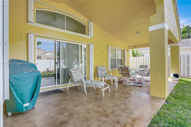 view of patio featuring fence