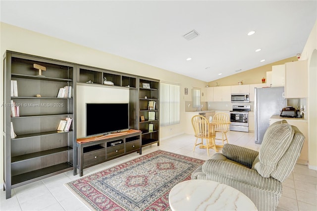 living area featuring light tile patterned flooring, visible vents, recessed lighting, and lofted ceiling