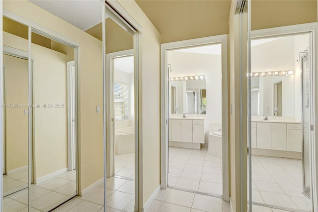 hallway with light tile patterned floors