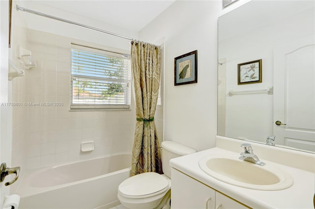 bathroom with toilet, vanity, and shower / bath combo