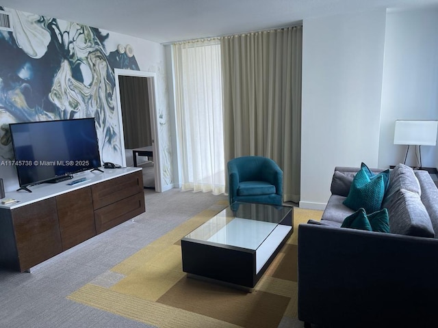 living area featuring light colored carpet