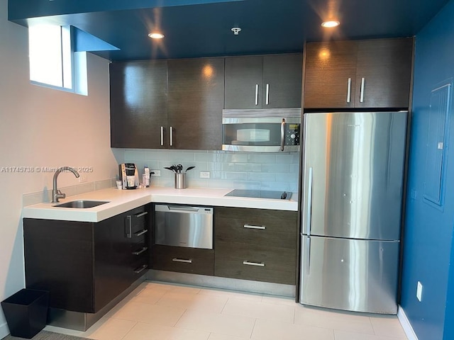17315 Collins Ave Unit 1107, Sunny Isles Beach, FL 33160 - kitchen featuring appliances with stainless steel finishes, light countertops, tasteful backsplash, modern cabinets, and recessed lighting