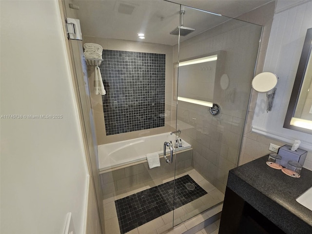 17315 Collins Ave Unit 1107, Sunny Isles Beach, FL 33160 - bathroom with a shower stall, a relaxing tiled tub, vanity, and tile patterned floors