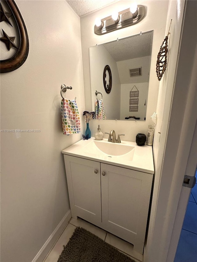 10023 SW 77th Ct, Miami, FL 33156 - bathroom featuring vanity, tile patterned floors, and a textured ceiling