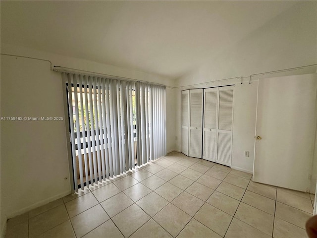 10023 SW 77th Ct, Miami, FL 33156 - unfurnished bedroom featuring light tile patterned floors and a closet