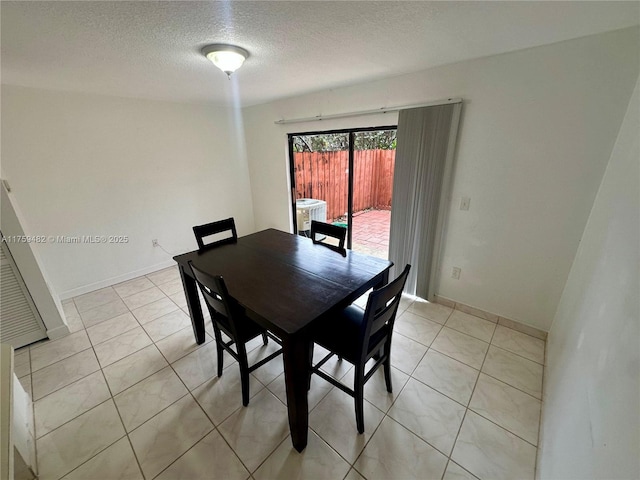 10023 SW 77th Ct, Miami, FL 33156 - dining area with a textured ceiling and light tile patterned floors