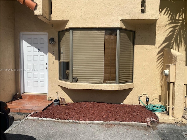 10023 SW 77th Ct, Miami, FL 33156 - entrance to property with stucco siding