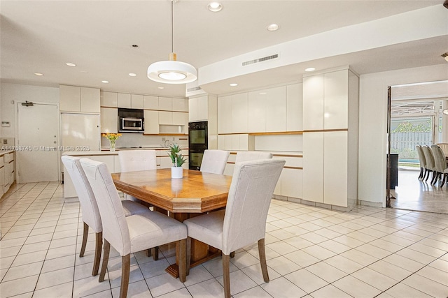 dining space featuring recessed lighting, visible vents, and light tile patterned flooring