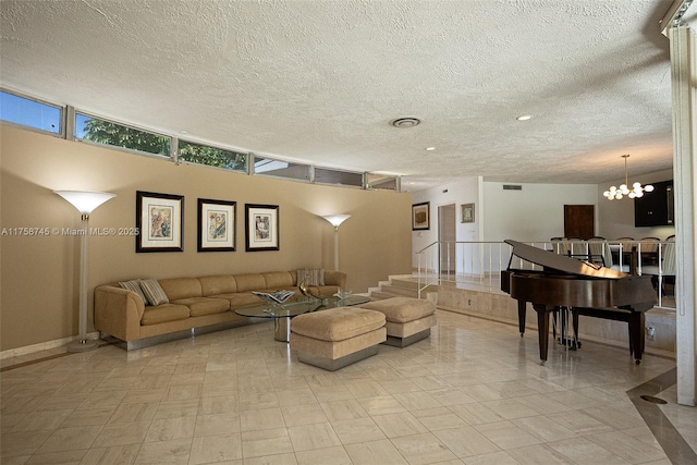 living area with a textured ceiling, a chandelier, and stairs