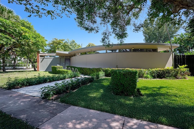 exterior space with a yard and fence