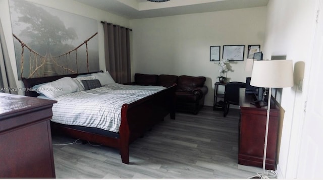 bedroom featuring wood finished floors