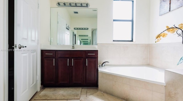 full bath with tile patterned flooring, visible vents, a bath, an enclosed shower, and vanity