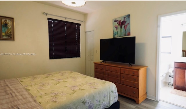 bedroom featuring wood finished floors