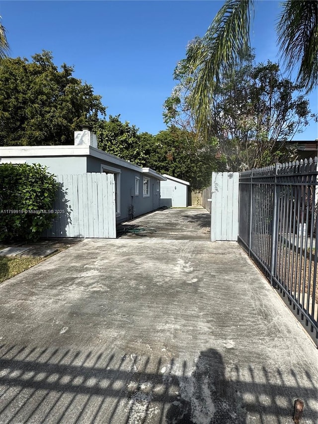 exterior space featuring stucco siding and fence