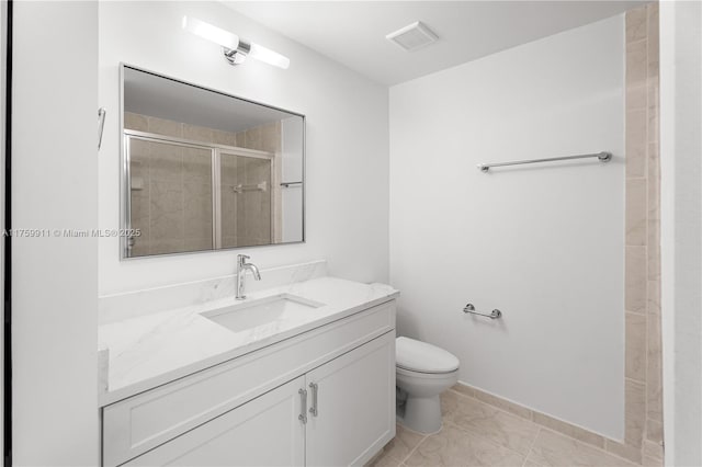 bathroom featuring vanity, toilet, visible vents, and a stall shower