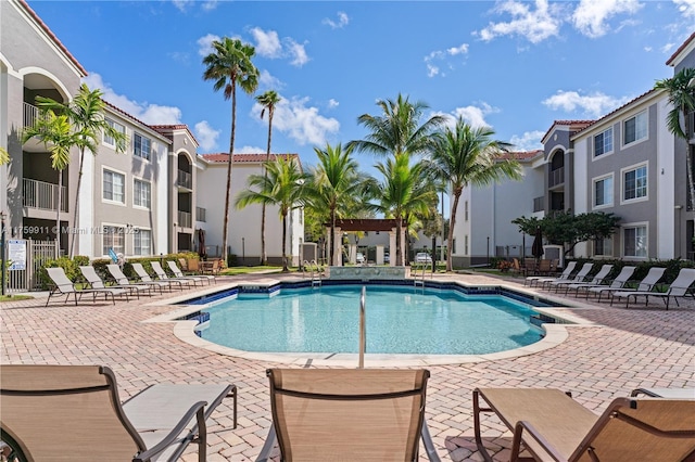 pool featuring a patio and fence