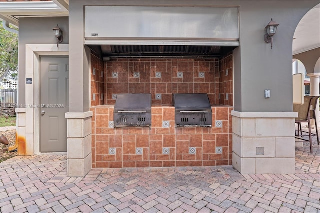 view of patio / terrace featuring area for grilling and exterior kitchen