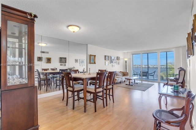 1175 NE Miami Gardens Dr Unit 610, Miami, FL 33179 - dining room featuring light wood finished floors