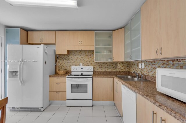 1175 NE Miami Gardens Dr Unit 610, Miami, FL 33179 - kitchen featuring white appliances, a sink, light brown cabinets, and tasteful backsplash