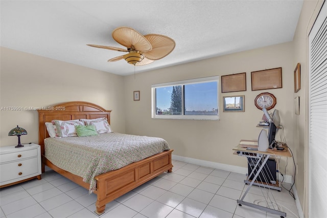1175 NE Miami Gardens Dr Unit 610, Miami, FL 33179 - bedroom with ceiling fan, baseboards, and light tile patterned floors