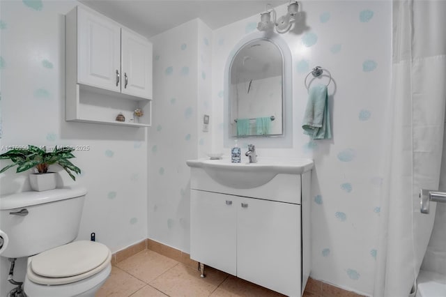 1175 NE Miami Gardens Dr Unit 610, Miami, FL 33179 - full bathroom featuring vanity, toilet, tile patterned flooring, a shower with shower curtain, and baseboards