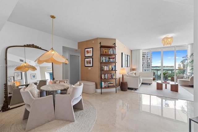 dining room featuring baseboards, marble finish floor, and expansive windows