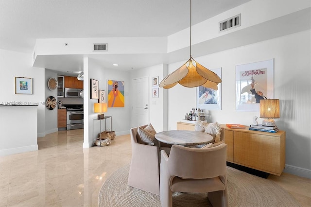 dining room with baseboards, visible vents, and marble finish floor