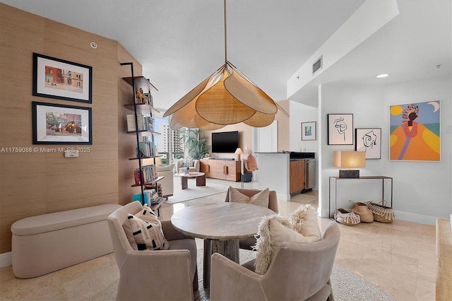 dining room featuring visible vents, marble finish floor, and baseboards