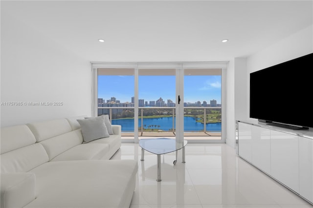 living room with recessed lighting and floor to ceiling windows