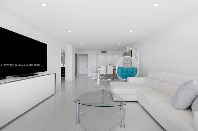 living room with recessed lighting and visible vents