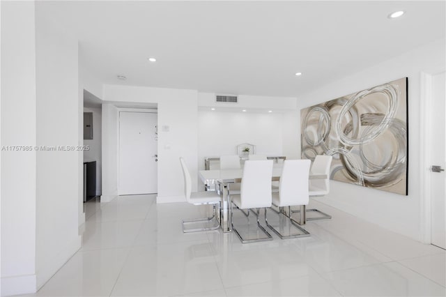 tiled dining room with electric panel, visible vents, recessed lighting, and baseboards