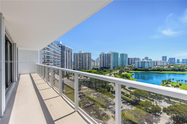 balcony with a view of city and a water view