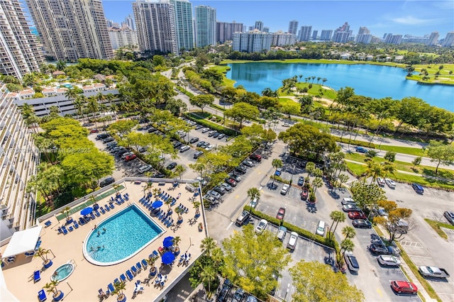 bird's eye view featuring a water view and a city view