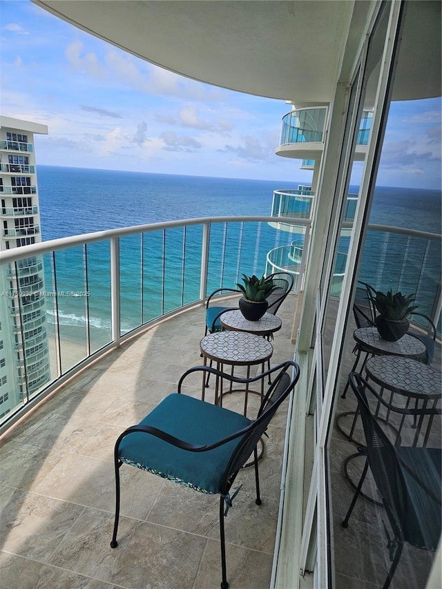 balcony featuring a water view