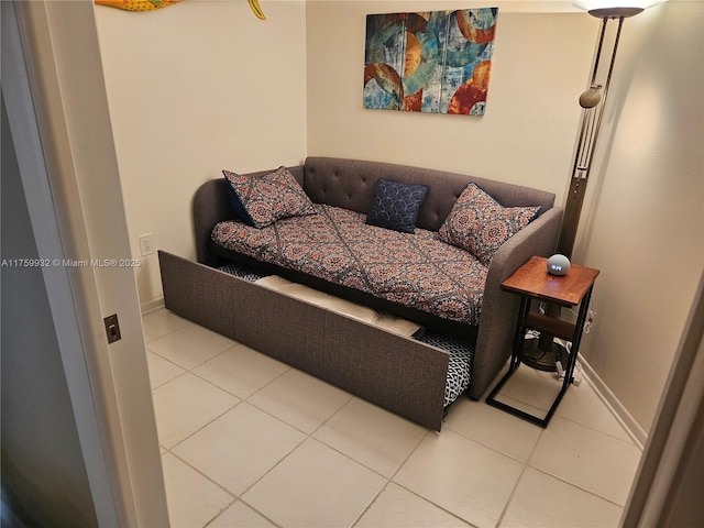 interior space with tile patterned floors and baseboards