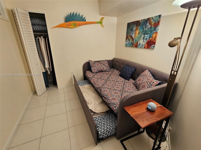 living room with tile patterned floors and baseboards