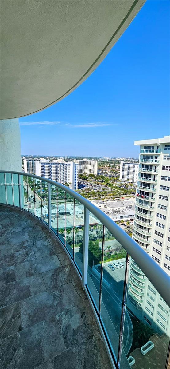 balcony featuring a city view