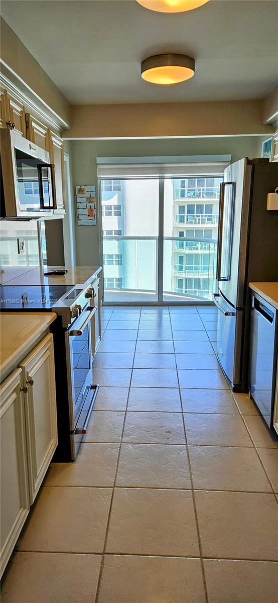 kitchen featuring stainless steel appliances and light countertops