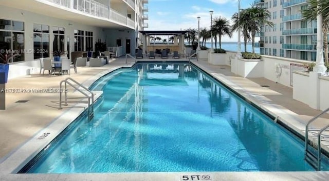 1200 Brickell Bay Dr Unit 3318, Miami, FL 33131 - community pool with a patio area