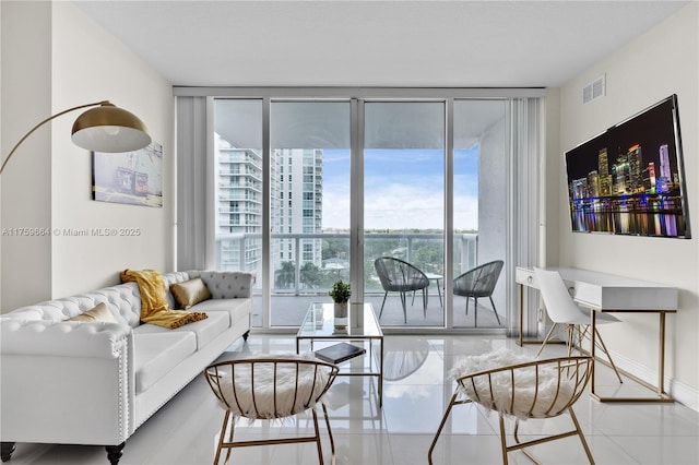 1861 NW S River Dr Unit 1003, Miami, FL 33125 - living area with visible vents, baseboards, and floor to ceiling windows