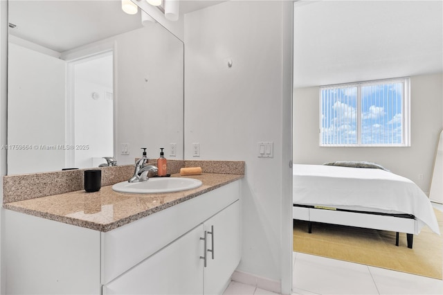 bathroom featuring ensuite bath and vanity