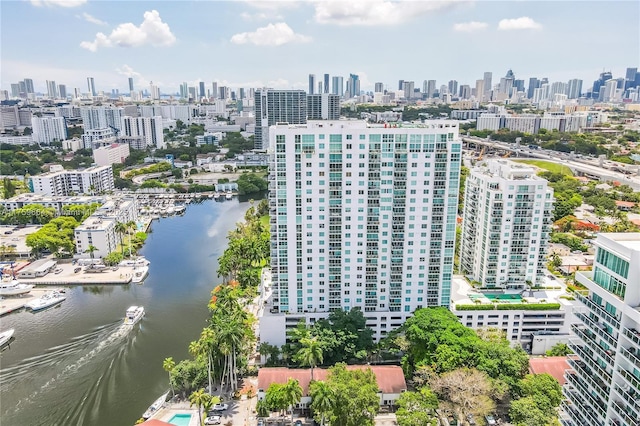 birds eye view of property featuring a city view and a water view