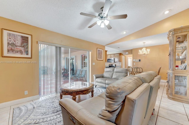 living room featuring vaulted ceiling, light tile patterned flooring, ceiling fan with notable chandelier, and a textured ceiling