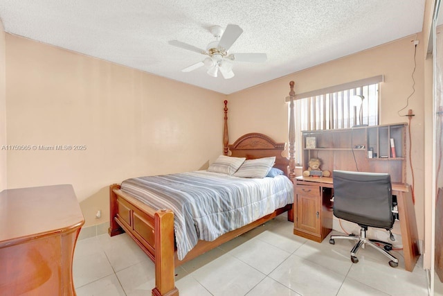 bedroom with light tile patterned floors, a textured ceiling, and ceiling fan