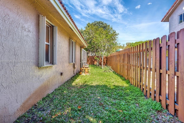 view of yard with a fenced backyard