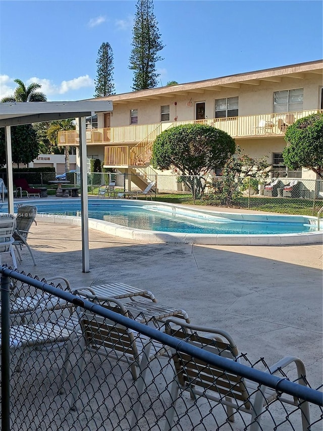 community pool with fence