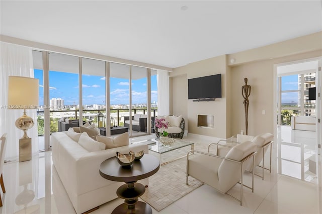 living area featuring floor to ceiling windows