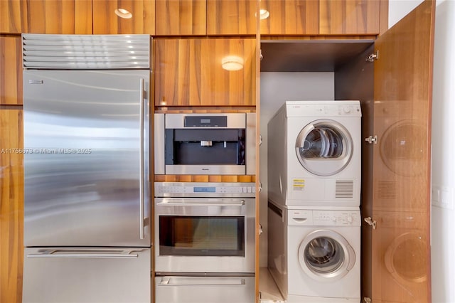 laundry room featuring laundry area and stacked washing maching and dryer